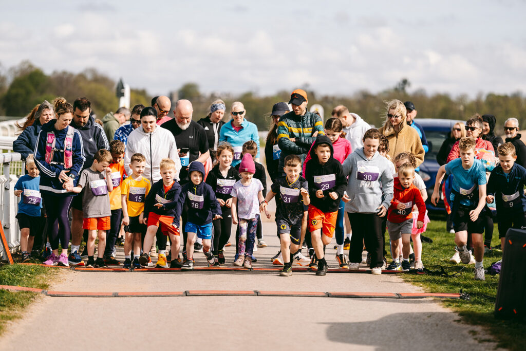 Runners at the 2025 TEWV 10k, York Racecourse.