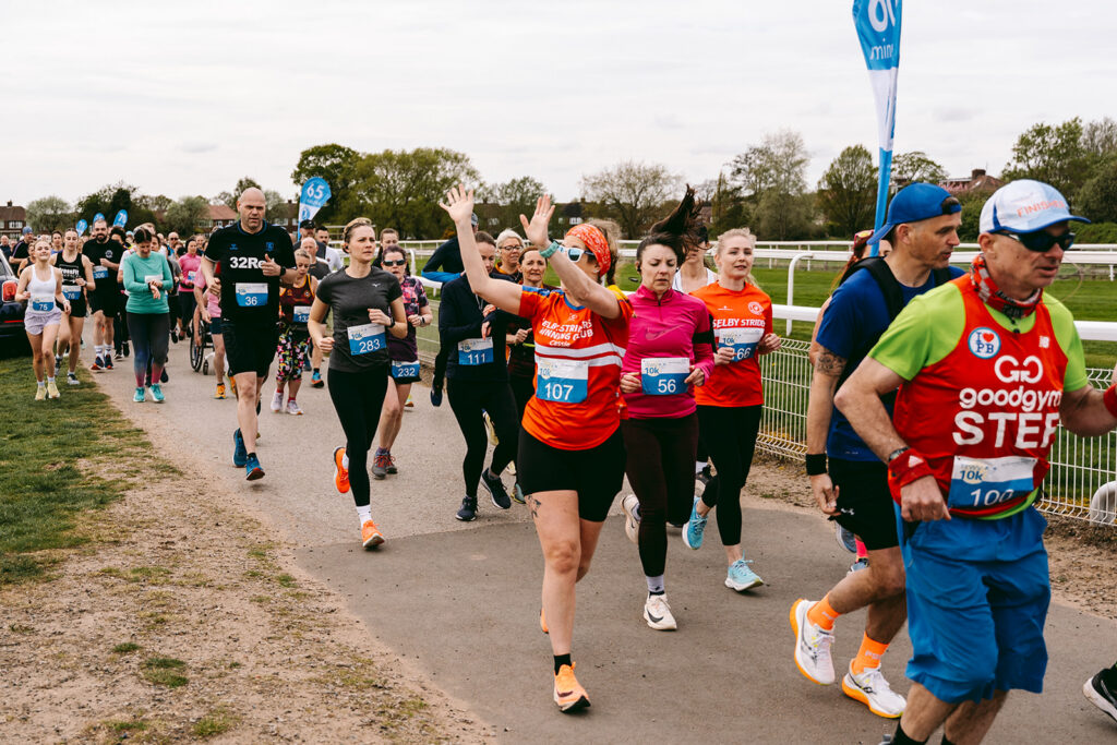 Runners at the 2025 TEWV 10k, York Racecourse.