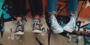 Teenagers sitting on wall